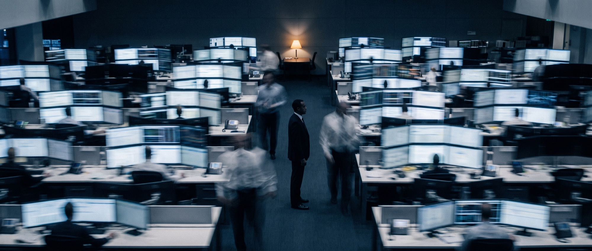 A trading floor blurred in motion around one still figure, Frame photographic style
